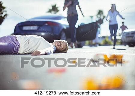 Driver rushing to injured girl on street View Large Photo Image Stock Photo - Driver rushing to injured girl on street. Fotosearch