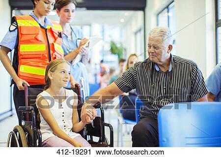 Man holding granddaughter's hand in hospital View Large Photo Image Stock Image - Man holding granddaughter's hand in hospital. Fotosearch