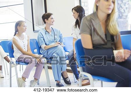 Nurse and patients talking in hospital View Large Photo Image Stock Photo - Nurse and patients talking in hospital. Fotosearch