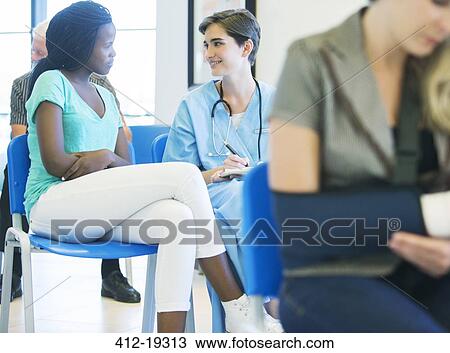 Nurse talking to patient in hospital View Large Photo Image Stock Image - Nurse talking to patient in hospital. Fotosearch