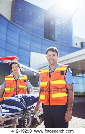 Paramedics smiling outside hospital View Large Photo Image Stock Photo - Paramedics smiling outside hospital. Fotosearch