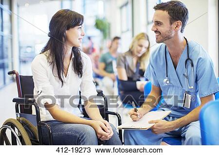 Patient in wheelchair talking to nurse in hospital View Large Photo Image Stock Image - Patient in wheelchair talking to nurse in hospital. Fotosearch