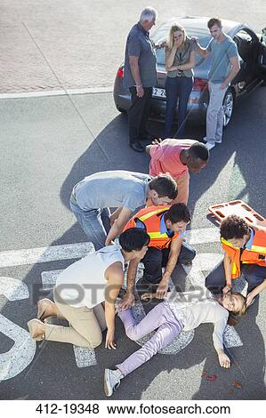 Stock Photo - People rushing to injured girl in street . Fotosearch