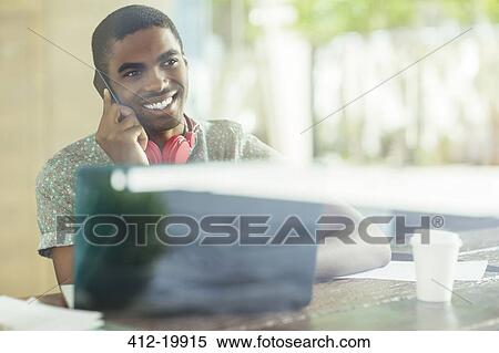 Stock Photography - Man talking on cell phone. Fotosearch