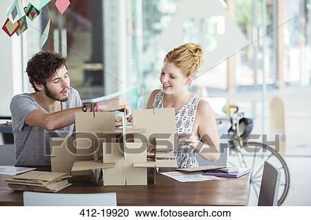 People building model together View Large Photo Image Stock Image - People building model together. Fotosearch