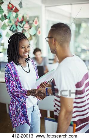 People shaking hands in office View Large Photo Image Stock Image - People shaking hands in office. Fotosearch