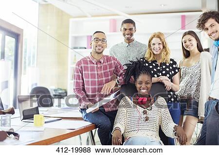 People smiling together in office View Large Photo Image Stock Photo - People smiling together in office. Fotosearch
