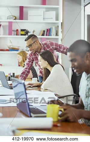 People working at conference table in office View Large Photo Image Stock Image - People working at conference table in office. Fotosearch