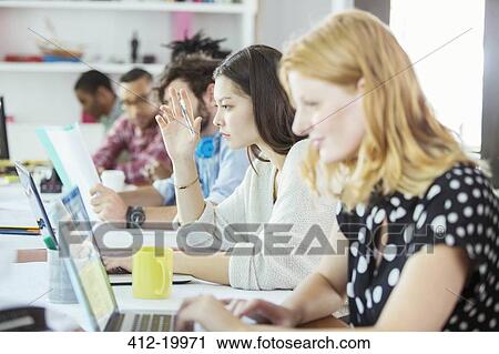 People working at conference table in office View Large Photo Image Stock Image - People working at conference table in office. Fotosearch