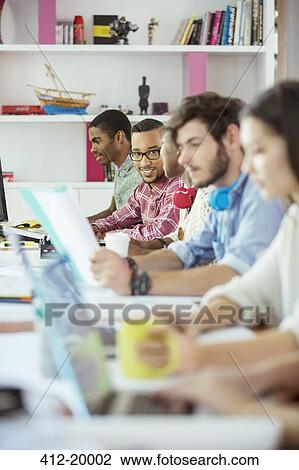 People working at conference table in office View Large Photo Image Stock Image - People working at conference table in office. Fotosearch
