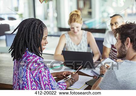 People working at conference table in office View Large Photo Image Stock Image - People working at conference table in office. Fotosearch