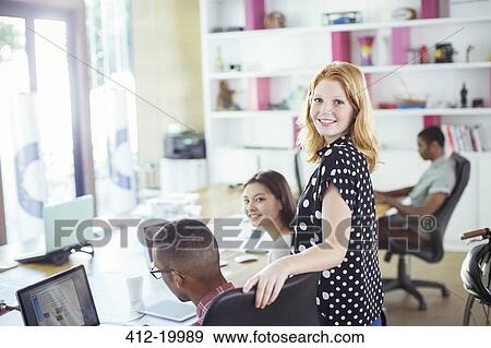People working at conference table in office View Large Photo Image Stock Photo - People working at conference table in office. Fotosearch