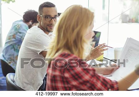 People working at conference table View Large Photo Image Stock Photo - People working at conference table. Fotosearch