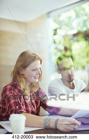 People working together in cafe View Large Photo Image Stock Image - People working together in cafe. Fotosearch