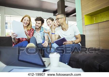 Stock Photo - People working together in cafe. Fotosearch