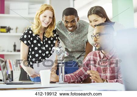People working together in office View Large Photo Image Stock Image - People working together in office. Fotosearch