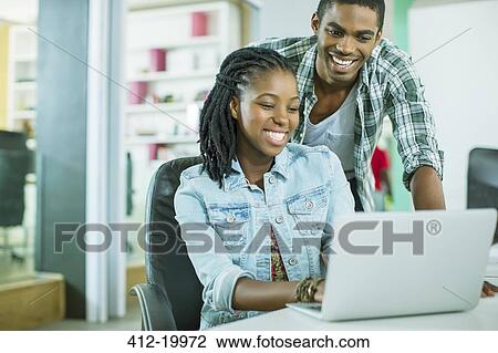 People working together in office View Large Photo Image Stock Image - People working together in office. Fotosearch