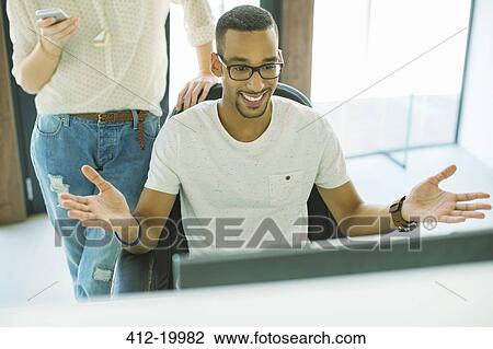 People working together in office View Large Photo Image Stock Image - People working together in office. Fotosearch