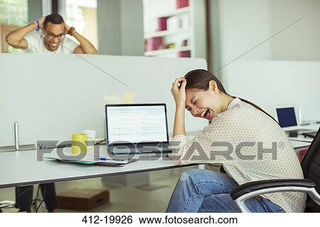 Woman working at laptop in office View Large Photo Image Stock Photograph - Woman working at laptop in office. Fotosearch
