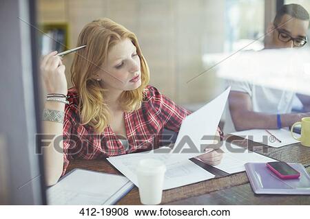 Woman working in cafe View Large Photo Image Stock Photo - Woman working in cafe. Fotosearch