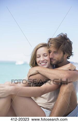 Couple hugging outdoors View Large Photo Image Stock Image - Couple hugging outdoors . Fotosearch
