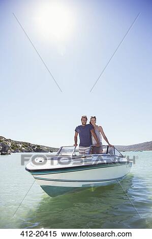 Couple standing in boat together View Large Photo Image Stock Photography - Couple standing in boat together . Fotosearch
