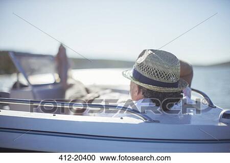 Older man relaxing in boat on water View Large Photo Image Stock Image - Older man relaxing in boat on water. Fotosearch