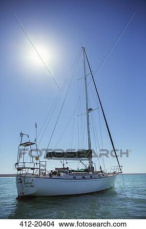 Sailboat in water on sunny day View Large Photo Image Picture - Sailboat in water on sunny day. Fotosearch