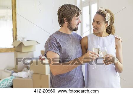 Couple celebrating with drinks View Large Photo Image Stock Image - Couple celebrating with drinks . Fotosearch
