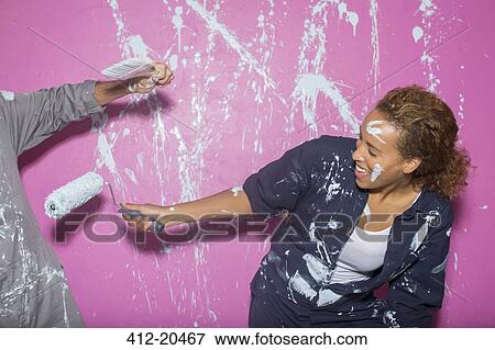 Couple playing with paint View Large Photo Image Stock Photo - Couple playing with paint . Fotosearch