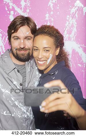 Couple taking picture together on cell phone View Large Photo Image Stock Image - Couple taking picture together on cell phone . Fotosearch