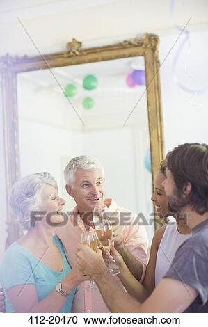 Family celebrating with drinks View Large Photo Image Stock Image - Family celebrating with drinks. Fotosearch