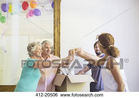Stock Photograph - Family celebration with drinks . Fotosearch