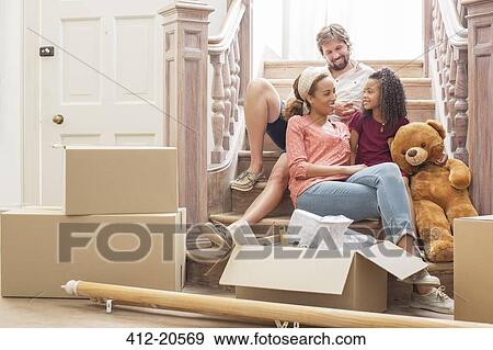 Family talking on stairs together View Large Photo Image Stock Photo - Family talking on stairs together . Fotosearch
