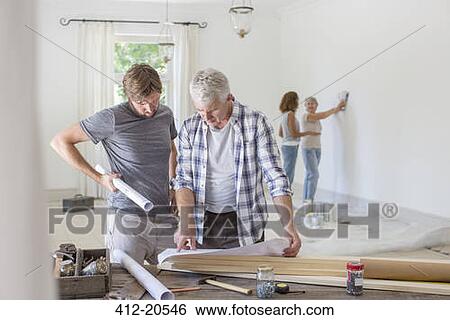Family working in living space together View Large Photo Image Stock Photograph - Family working in living space together . Fotosearch