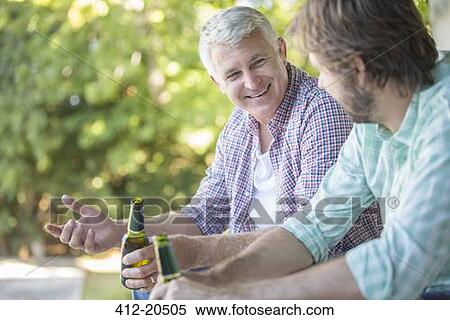 Father and son drinking outdoors View Large Photo Image Stock Photography - Father and son drinking outdoors. Fotosearch