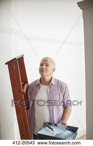 Man carrying ladder and paint tray View Large Photo Image Stock Image - Man carrying ladder and paint tray. Fotosearch