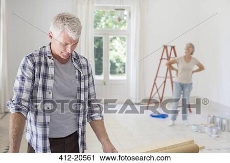 Older couple observing new living space View Large Photo Image Stock Image - Older couple observing new living space . Fotosearch