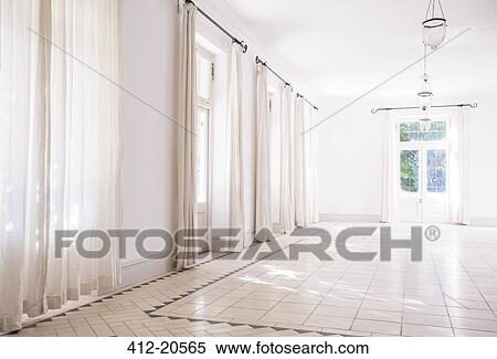 Sunlight streaming through windows of living space View Large Photo Image Stock Photography - Sunlight streaming through windows of living space . Fotosearch