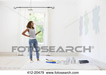 Woman observing paint swatches View Large Photo Image Stock Photo - Woman observing paint swatches . Fotosearch