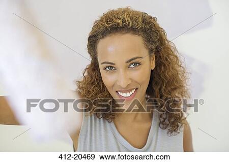 Woman smiling indoors View Large Photo Image Stock Photo - Woman smiling indoors . Fotosearch
