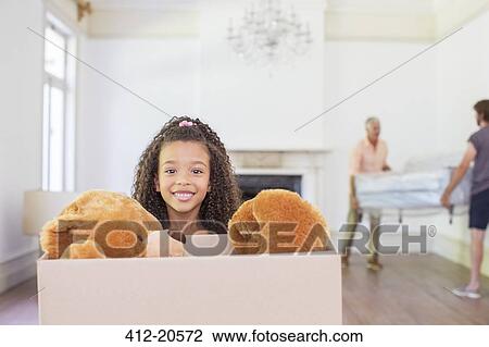 Young girl carrying box with teddy bear inside View Large Photo Image Stock Image - Young girl carrying box with teddy bear inside . Fotosearch