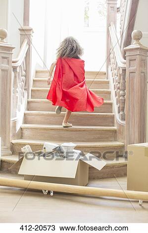 Young girl running up stairs playing View Large Photo Image Stock Image - Young girl running up stairs playing . Fotosearch