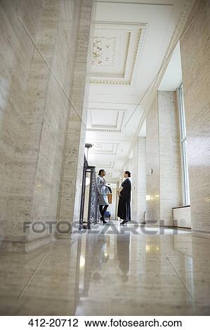 Judge and lawyer talking in courthouse View Large Photo Image Stock Image - Judge and lawyer talking in courthouse. Fotosearch
