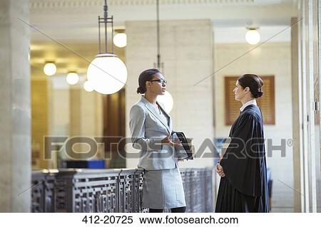 Judge and lawyer talking in courthouse View Large Photo Image Stock Photography - Judge and lawyer talking in courthouse. Fotosearch