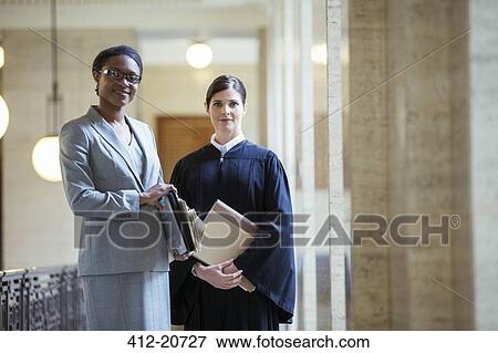 Judge and lawyer together in courthouse View Large Photo Image Stock Photo - Judge and lawyer together in courthouse. Fotosearch