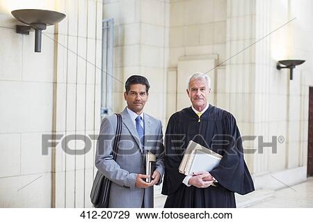 Stock Photo - Judge and lawyer together in courthouse. Fotosearch