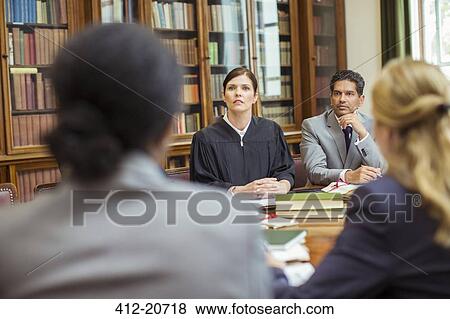 Stock Photo - Judge and lawyers talking in chambers. Fotosearch