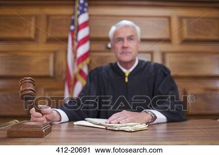 Stock Image - Judge banging gavel in court . Fotosearch