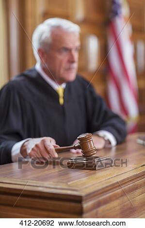 Stock Image - Judge banging gavel in court . Fotosearch